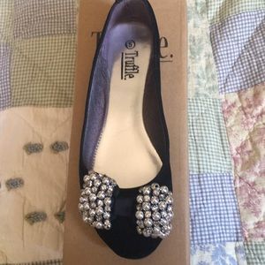 Black suede flats with silver bow